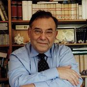 è Direttore della Scuola Internazionale Superiore di Studi Avanzati di Trieste (Sissa); è inoltre Professore di Biologia e Genetica all’Università Vita-Salute e Direttore di ricerca CNR presso l’Istituto di Farmacologia Molecolare e Cellulare del CNR di Milano.
Fisico di formazione, si è dedicato allo studio della genetica e della biologia molecolare degli animali superiori e dell’uomo. è membro dell’Accademia Europea e dell’EMBO, l’Organizzazione Europea per la Biologia Molecolare. È stato a capo del Laboratorio di Biologia Molecolare dello Sviluppo all’Istituto Scientifico H. San Raffaele.
Gli attuali studi vanno dalla primissima determinazione dell’asse corporeo alla strutturazione della corteccia cerebrale. I suoi interessi culturali si vanno spostando verso le neuroscienze e l’indagine delle funzioni mentali superiori.